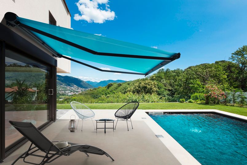 Soltis Lounge 96 retractable awning shading fabric installed for a pool area.