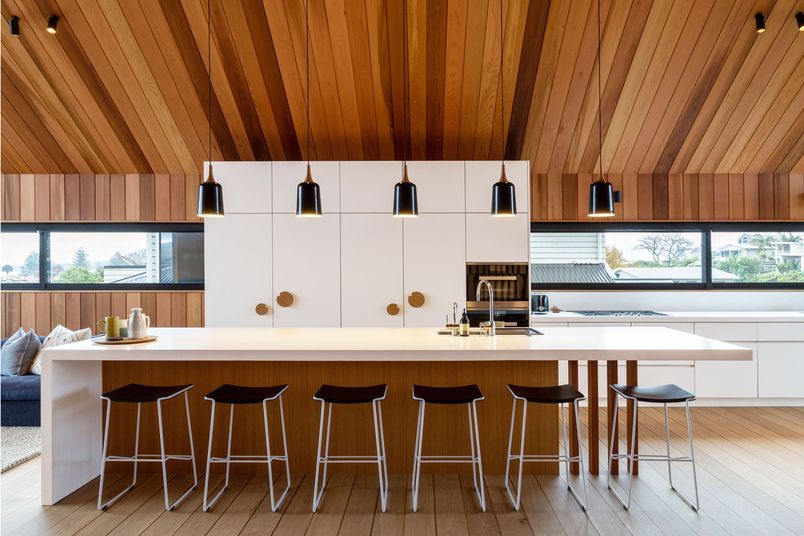 Polaris laminated plywood benchtops and cabinets were specified for this Mount Maunganui home. Architect: Studio2 Architects.
